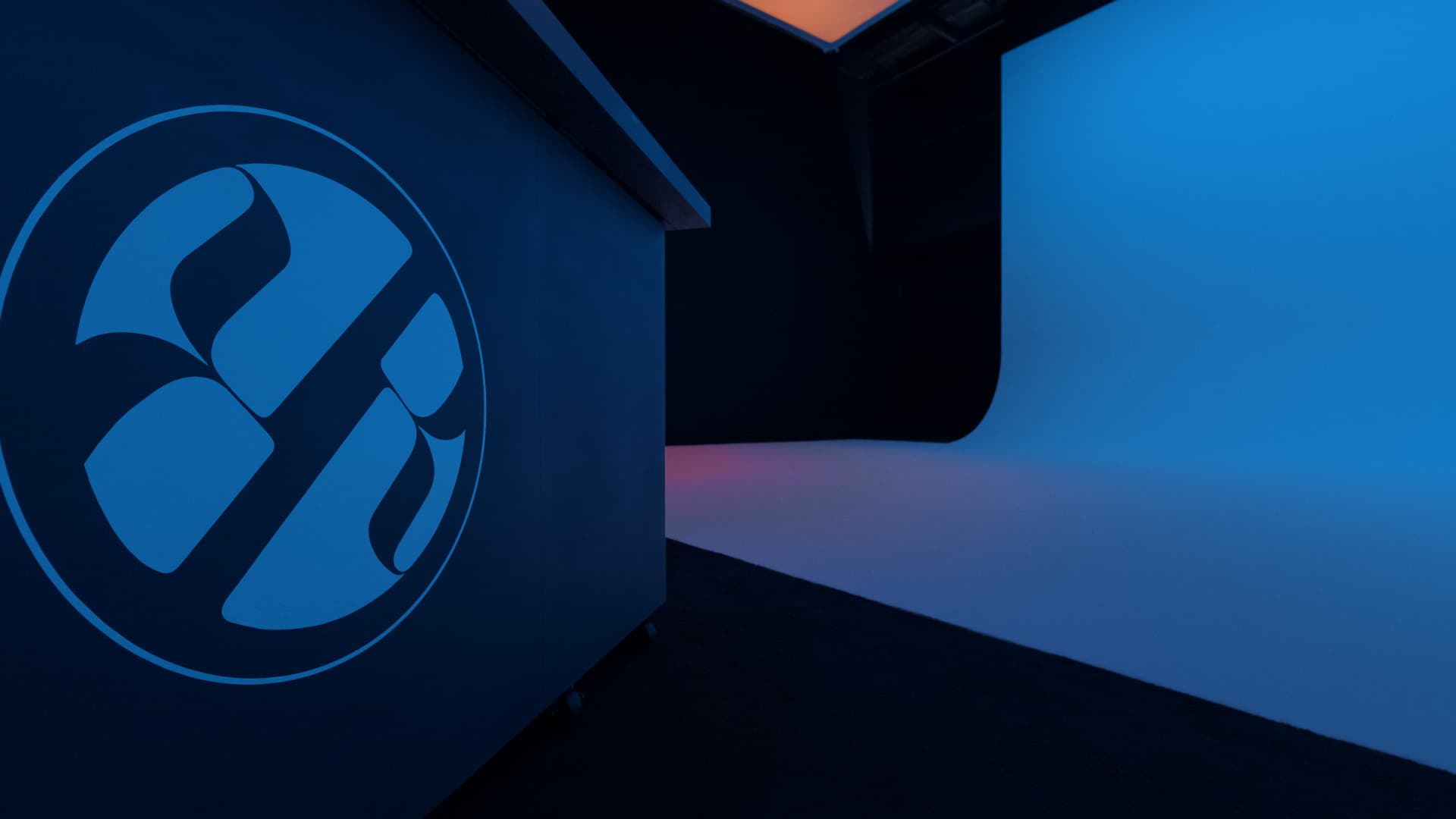 REVCINE Studio — blue branded wall